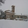 De dorpskerk, onze buurman, in de sneeuw